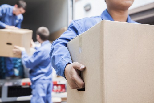 Furniture removals team handling bulky items in Greenwich streets