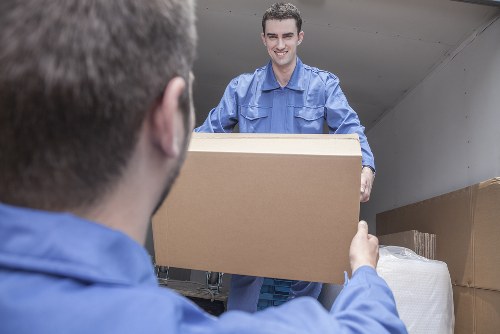 Removal team preparing a van with safety focus