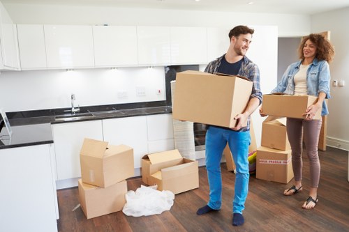 House removals team handling furniture and boxes during a Greenwich home move