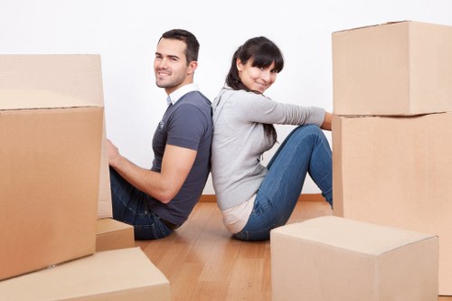 Local team collecting sofas and chairs from a Greenwich property